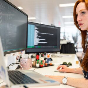 Web developers working on a business website at their desks